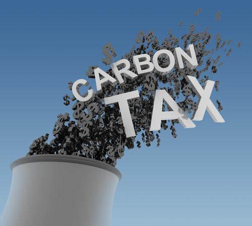 Smokestack emissions labeled Carbon Tax
