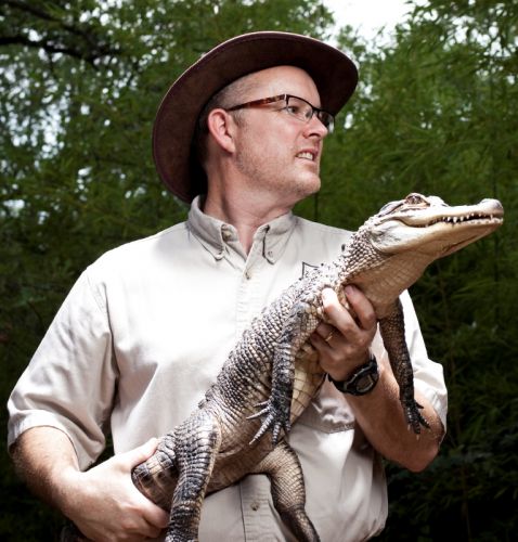 Critterman holding an aligator